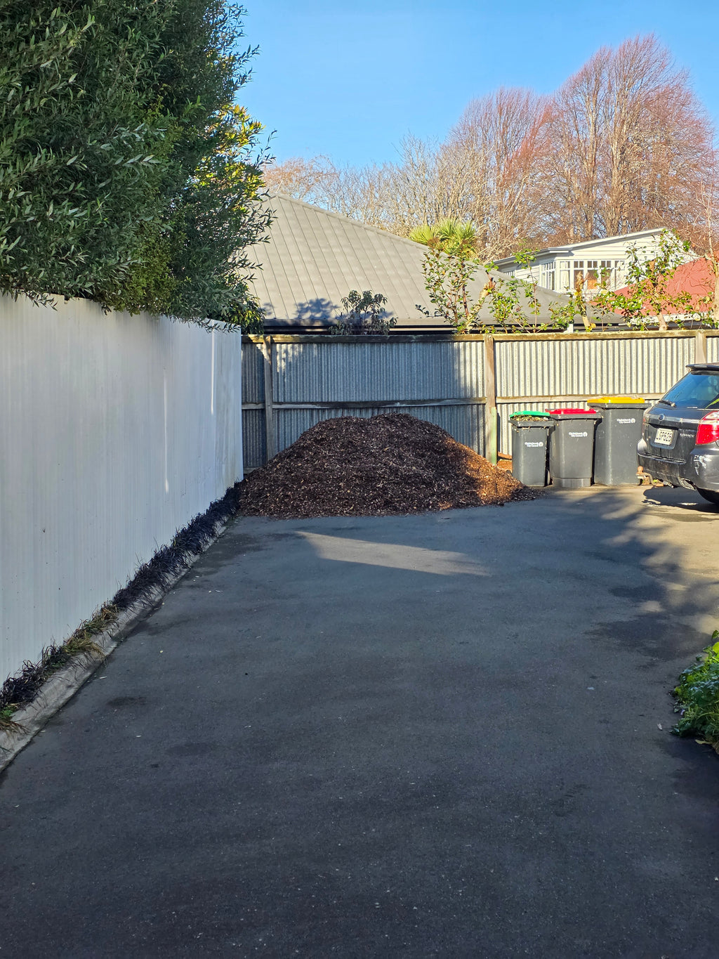 2m³ arborist mulch delivery tipped on a residential driveway in Christchurch